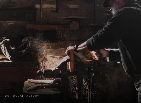 A craftsman working with wood in a workshop